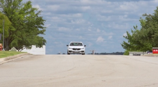 BMW drive over hill