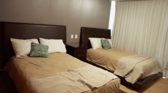 Cancun condo interior twin bed truck right