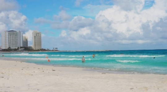 Cancun hotel zone beach people swimming - static -1 slo mo