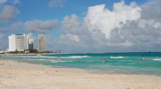 Cancun hotel zone beach people swimming - static -2 slo mo