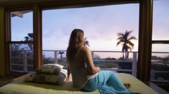 Girl sitting near window