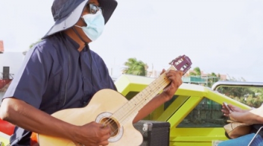 Isla Muieres masked guitar player on boat - 2