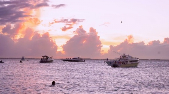 Isla Mujeres boats at sunset static shot - 1 slo mo