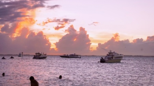 Isla Mujeres boats at sunset static shot 