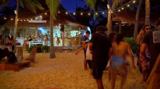 Isla Mujeres people dancing at beach bar  -  2 slo mo