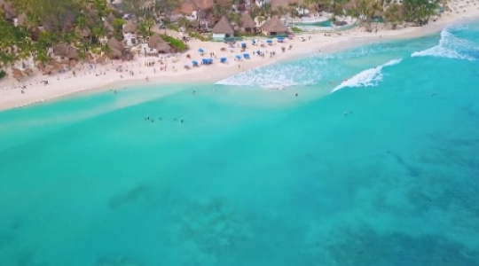 Playa Del Carmen beach slow tilt up pan right