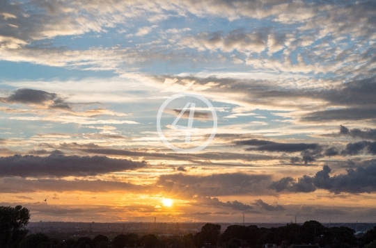 Cloudy sky with sun