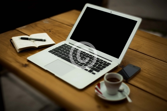 Laptop on wooden table