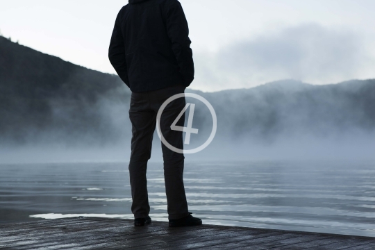 Man standing on a jetty